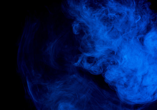 Abstract smoke Weipa. Personal vaporizers fragrant steam. The concept of alternative non-nicotine smoking. Blue smoke on a black background. E-cigarette. Evaporator. Taking Close-up. Vaping.