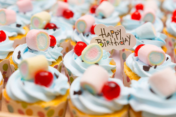 Fototapeta na wymiar Colorful birthday cupcakes