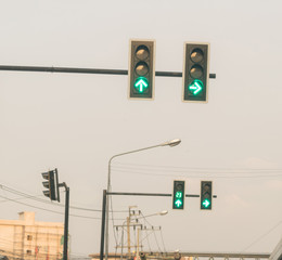 Traffic light, green light, red light on the intersection.