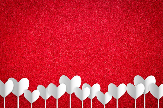 Valentine's day abstract background with cut paper heart on red carpet.

