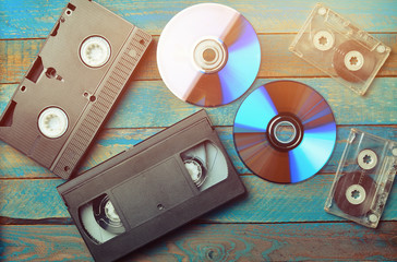 Audio cassettes, cassettes videos, CDs. The evolution of media. - obrazy, fototapety, plakaty