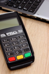 Credit card reader for paying and laptop, finance concept