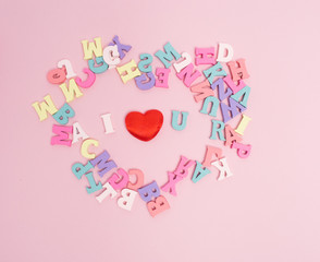 Vanlentine's day concept. Wooden letters word love and red heart  and car vintage on color background with copy space.