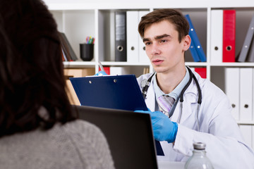 Doctor talking with patient