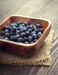 ripe sweet blueberries on wooden table