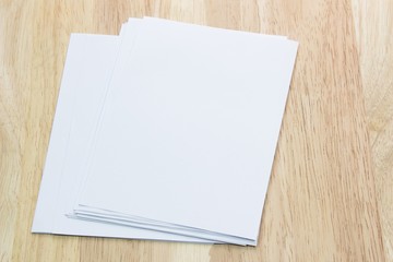 Blank portrait A4. brochure magazine isolated on wooden table, changeable background