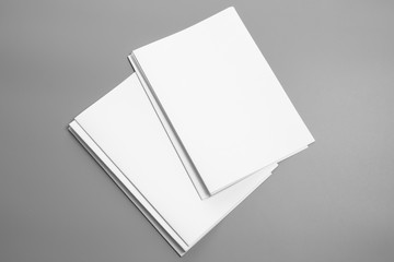 Blank portrait A4. brochure magazine isolated on gray, changeable background / white paper isolated on gray