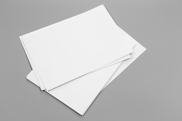 Blank portrait A4. brochure magazine isolated on gray, changeable background / white paper isolated on gray