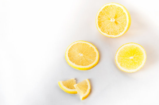 Lemon sliced lies on a white background