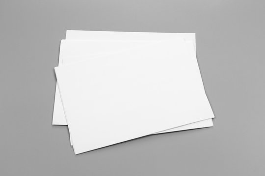 Blank portrait A4. brochure magazine isolated on gray, changeable background / white paper isolated on gray