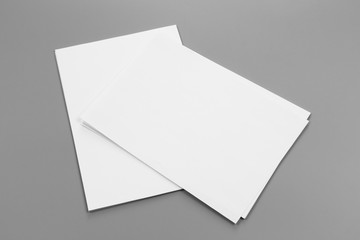 Blank portrait A4. brochure magazine isolated on gray, changeable background / white paper isolated on gray