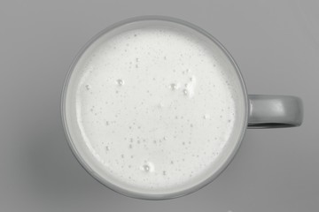 top view of glass milk / Glass of Milk From Above / gray tone
