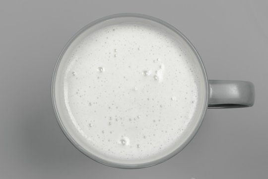 top view of glass milk / Glass of Milk From Above / gray tone