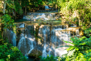 Fototapeta na wymiar Beautiful Waterfall in Deep Forest with Sunlight.