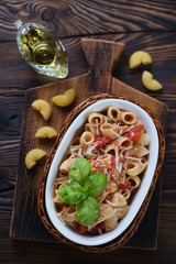 Italian pipe rigate pasta with tomato sauce and cheese, top view