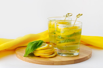 Fresh drink with lemon, kiwi and basil