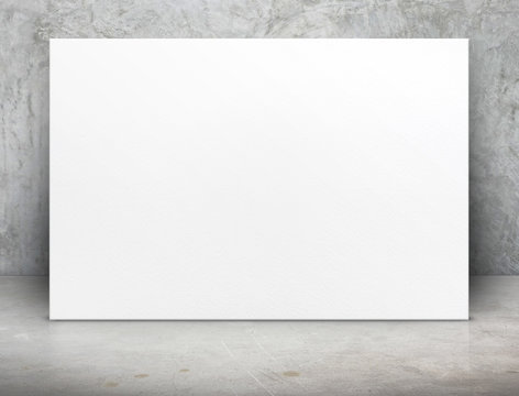 Blank white paper poster canvas at grunge concrete room,Mock up