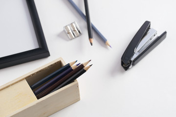 Office stationery. Pencil box, stapler and pencil sharpener on white background