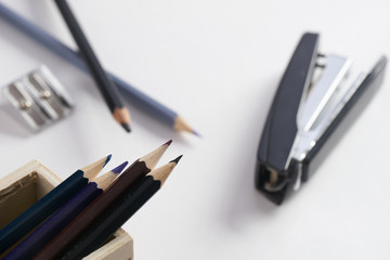 Office stationery. Pencil box, stapler and pencil sharpener on white background