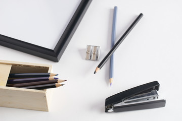 Office stationery. Pencil box, stapler and pencil sharpener on white background