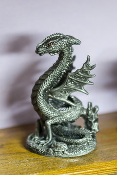 Pewter figurine basilisk.