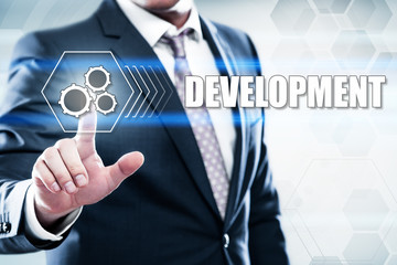 Business, technology, internet concept on hexagons and transparent honeycomb background. Businessman  pressing button on touch screen interface and select  development