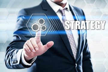 Business, technology, internet concept on hexagons and transparent honeycomb background. Businessman  pressing button on touch screen interface and select  strategy