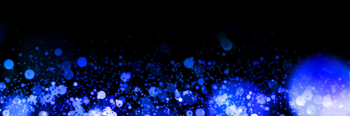 Fototapeta premium banner with bright blue bokeh effects in front of a black background