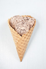 Cookie ice cream scoops in the cone.
