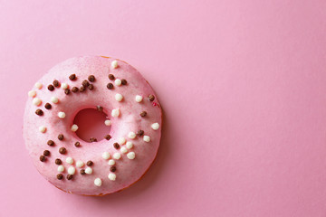 Delicious donut on pink background