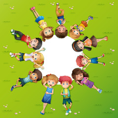 Boys and girls lying on grass