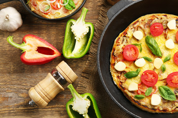 Freshly baked pizza in a pan