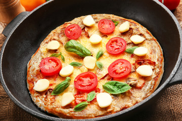 Freshly baked pizza in a pan