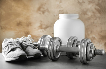 Fototapeta na wymiar Sports concept. Workout objects on grey background