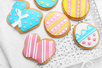 Delicious colourful Easter cookies on tray, closeup