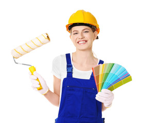 Beautiful young decorator on white background