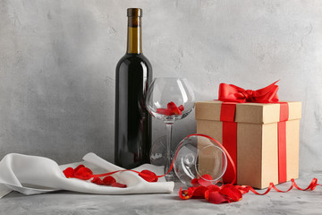 St. Valentines Day concept. Wine, roses and gift box on table