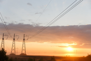 Electric lines at sunset time