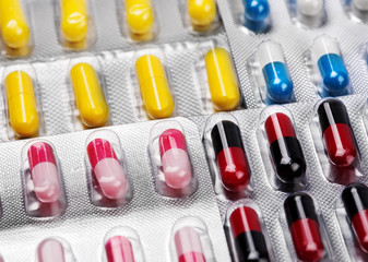 sinii red yellow pills on a white background