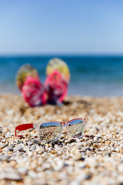 Photography of sunglasses background slippers