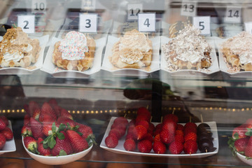 traditional sweet Belgian waffles with strawberries in the shop