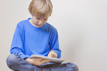 Fototapeta premium Child using digital tablet computer