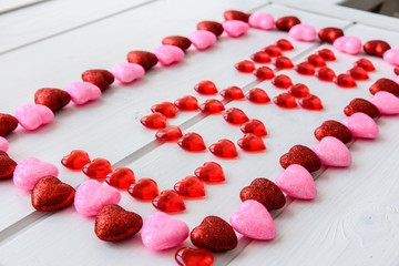 Valentines Day background with love text on grunge wooden desk