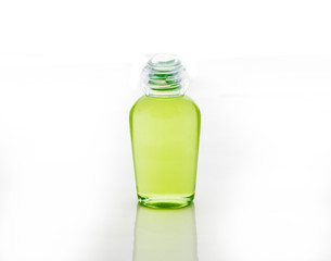 green bottle of shampoo, gel, soap
