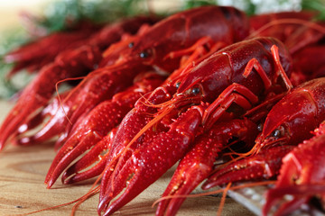 boiled crayfish on wooden table