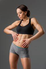 Obraz premium Beautiful fit girl in sport bra and shorts