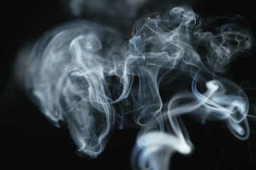 mystery dense blue smoke over dark background, abstract photo