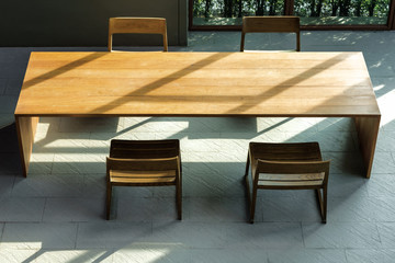 Wooden table and chair with sunlight space for background