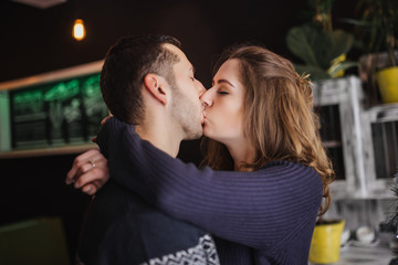 Fototapeta premium Couple in love. Romantic date of couple in love in cafe. Happy couple enjoying romantic moment in cafe. Love story.