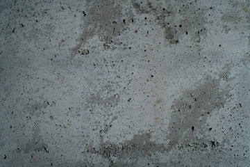 rough grey grungy concrete background, focus in the middle of frame